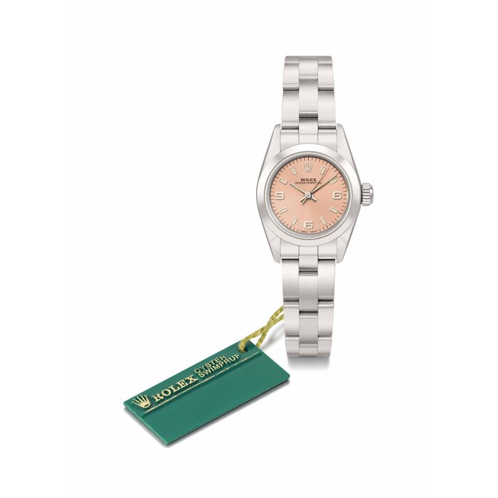 Rolex. A possibly unique stainless steel automatic wristwatch with pink dial erroneously displaying 6-6-9 hour markers, sweep centre seconds, bracelet and original guarantee SIGNED ROLEX, OYSTER PERPETUAL, REF. 67180, CASE NO. X898105, CIRCA 1991