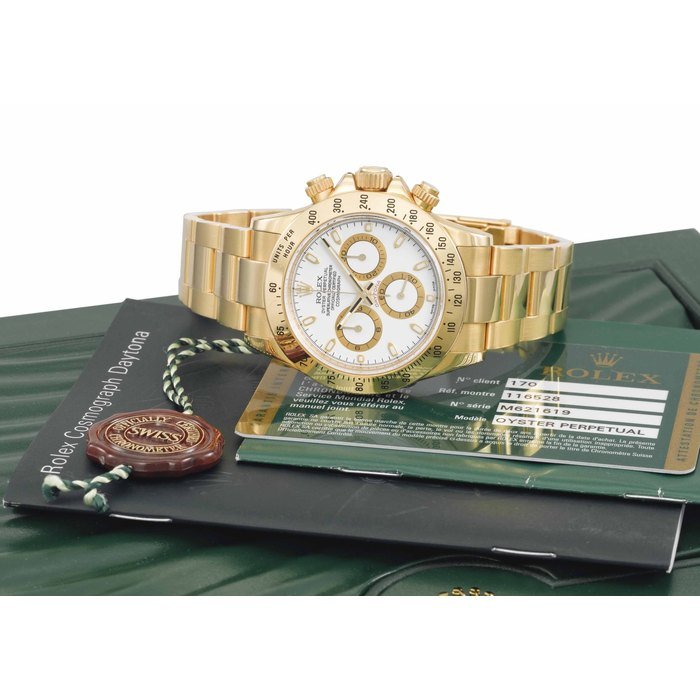 Rolex Rolex. A fine and impressive 18K gold automatic chronograph wristwatch with bracelet, original Guarantee and box SIGNED ROLEX, OYSTER PERPETUAL, COSMOGRAPH, DAYTONA, REF. 116528, MOVEMENT NO. C0332125, CASE NO. M621619, CIRCA 2007 · 116528