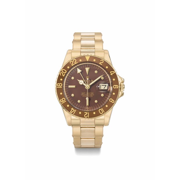 Rolex. A fine, rare and attractive 18K gold automatic dual time wristwatch with sweep centre seconds, date and bracelet SIGNED ROLEX, OYSTER PERPETUAL, GMT-MASTER, REF. 1675, CASE NO. 5'347'686, CIRCA 1979
