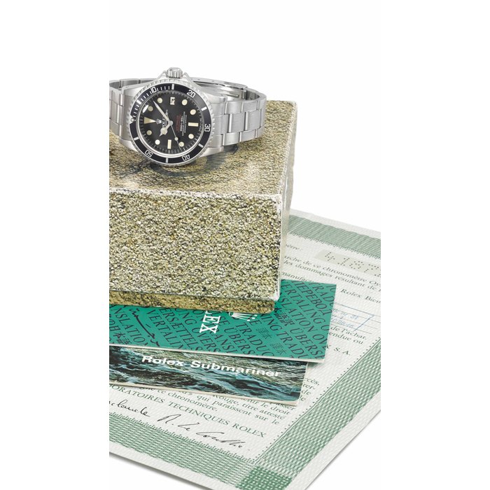 Rolex. A rare stainless steel automatic wristwatch with sweep centre seconds, date, gas escape valve, bracelet, original Garantie and box SIGNED ROLEX, OYSTER PERPETUAL DATE, SEA-DWELLER, SUBMARINER 2000, 2000 FT=610M, SUPERLATIVE CHRONOMETER OFFICIALLY CERTIFIED, "DOUBLE RED" MODEL, REF. 1665, CASE NO. 4'187'281, CIRCA 1976