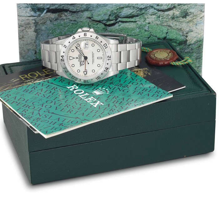 Rolex Rolex. A rare stainless steel automatic wristwatch with ivory-coloured dial, 24 hour hand, date, bracelet, guarantee and box SIGNED ROLEX, OYSTER PERPETUAL DATE, EXPLORER II, REF. 16570, CASE NO. X492616, CIRCA 1991 · 16570