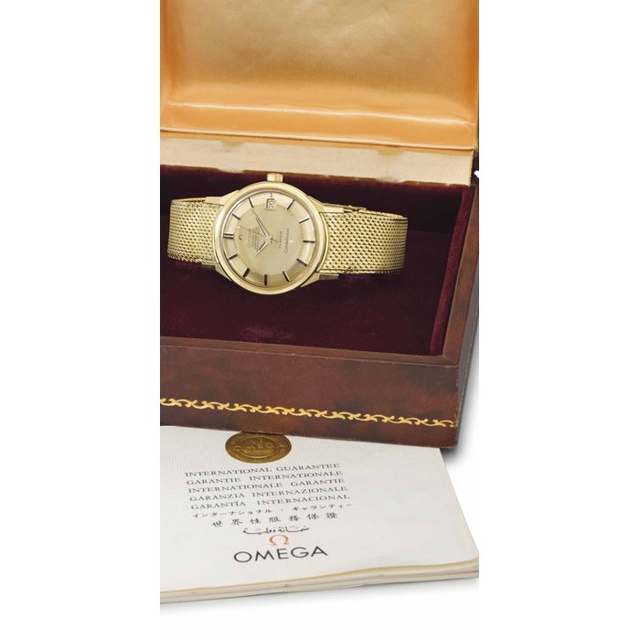 Omega. An 18K gold automatic wristwatch with sweep centre seconds, date, gold "pie-pan" dial, bracelet and box SIGNED OMEGA, AUTOMATIC, CHRONOMETER, CONSTELLATION, RETAILED BY TÜRLER, MOVEMENT NO. 24'439'736, CASE NO. 168005/6, MANUFACTURED IN 1966