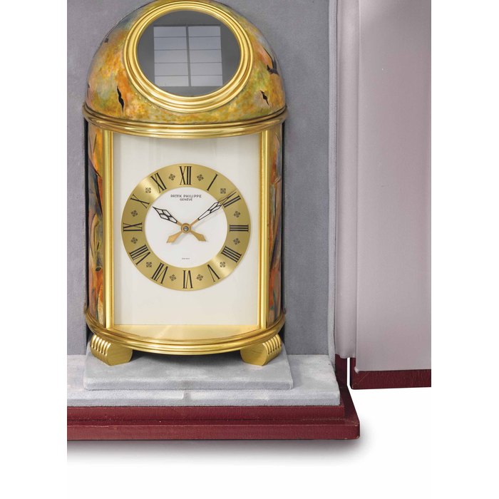 Patek Philippe. A very fine and unique gilt brass solar-powered dome table clock with cloisonné enamel by Elisabeth Perusset Lagger and presentation box SIGNED PATEK PHILIPPE, GENÈVE, REF. 1121, CASE NO. 1'803'464, MANUFACTURED IN 1976