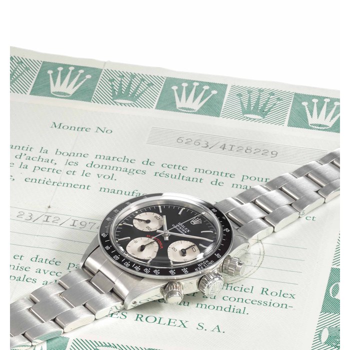 Rolex. A fine and rare stainless steel chronograph wristwatch with bracelet, guarantee and box SIGNED ROLEX, OYSTER COSMOGRAPH, REF. 6263, CASE NO. 4'128'229, CIRCA 1976