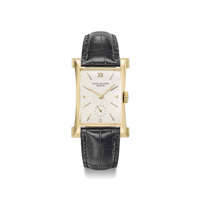 Patek Philippe. A fine and rare 18K gold rectangular wristwatch with sculpted lugs SIGNED PATEK PHILIPPE, GENÈVE, EIFFEL TOWER MODEL, REF. 2441, MOVEMENT NO. 975'118, CASE NO. 671'349, MANUFACTURED IN 1953