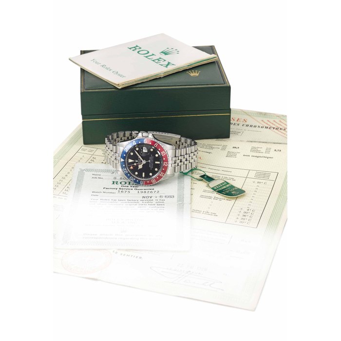 Rolex Rolex. A fine and very attractive stainless steel dual time automatic wristwatch with date, sweep centre seconds, bracelet, Guarantee and box SIGNED ROLEX, OYSTER PERPETUAL, GMT-MASTER, REF. 1675, CASE NO. 1'982'672, CIRCA 1968, Price & Market Data