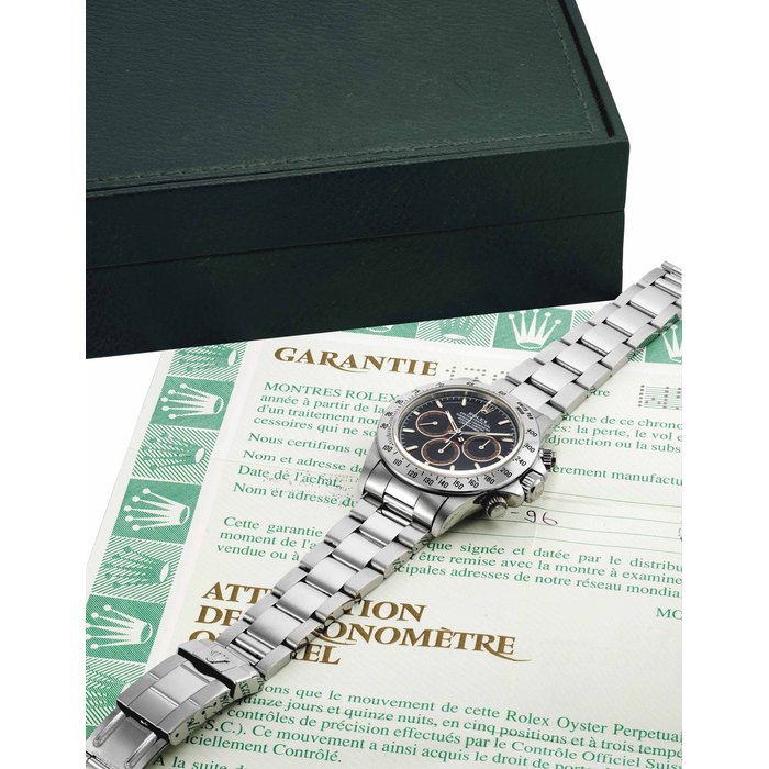 Rolex. A fine and rare stainless steel chronograph wristwatch with tropical dial, bracelet, Garantie and box SIGNED ROLEX, OYSTER PERPETUAL, COSMOGRAPH, DAYTONA, REF. 16520, CASE NO. W540979, CIRCA 1996