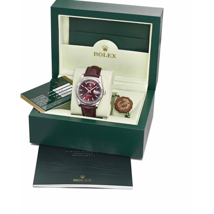 Rolex. An attractive 18K white gold automatic calendar wristwatch with sweep centre seconds, cherry dial, original Guarantee and box SIGNED ROLEX, OYSTER PERPETUAL, DAY-DATE, REF. 118139, CASE NO. 76G32112, CIRCA 2013
