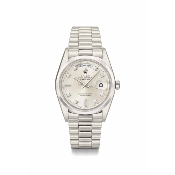 Rolex. A heavy and very fine platinum and diamond-set automatic calendar wristwatch with sweep centre seconds, bracelet and box SIGNED ROLEX, OYSTER PERPETUAL, DAY-DATE, REF. 18206, CASE NO. N269'743, CIRCA 1992