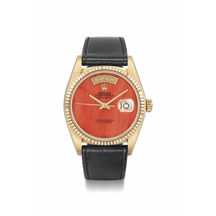 Rolex. A very rare and extremely fine 18K gold automatic wristwatch with day, date, sweep centre seconds, coral dial, Garantie and box SIGNED ROLEX, OYSTER PERPETUAL, DAY-DATE, REF. 18038, CASE NO. 6'588'072, CIRCA 1981