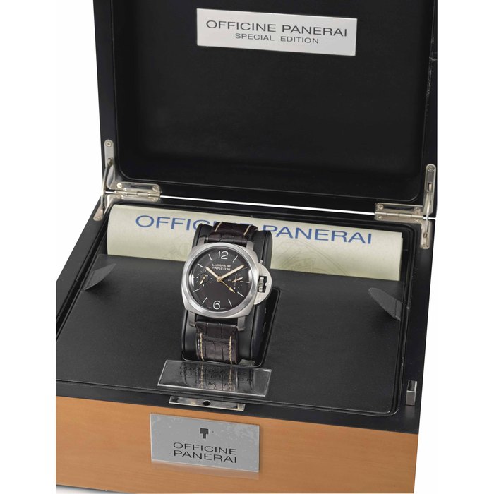 Panerai Panerai. A rare and large titanium limited series triple barrel cushion-shaped water-resistant dual time wristwatch with 6 days power reserve indicator, tourbillon, day and night indication for the second time zone, limited series Certificate and box SIGNED PANERAI, LUMINOR, 1950 TITANIUM TOURBILLON GMT MODEL, LIMITED EDITION NO. 127/150, REF. PAM 00306, INDIVIDUAL NOS. OP6737 BB1320626, CIRCA 2009, Price & Market Data