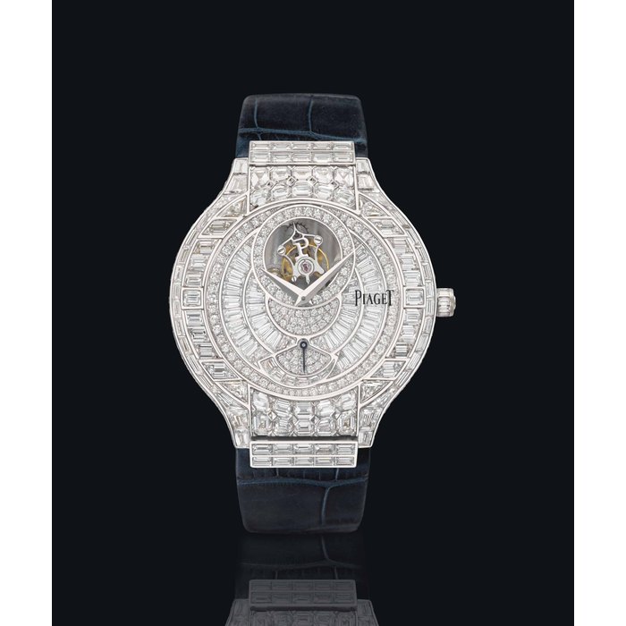 Piaget. An exceptional 18K white gold and diamond-set wristwatch with one minute flying tourbillon, power reserve, certificate and boxes 5IGNED PIAGET, POLO TOURBILLON MODEL, REF. G0A29065, NO. 02, CASE NOS. P10191 AND 923'682, MANUFACTURED IN 2004