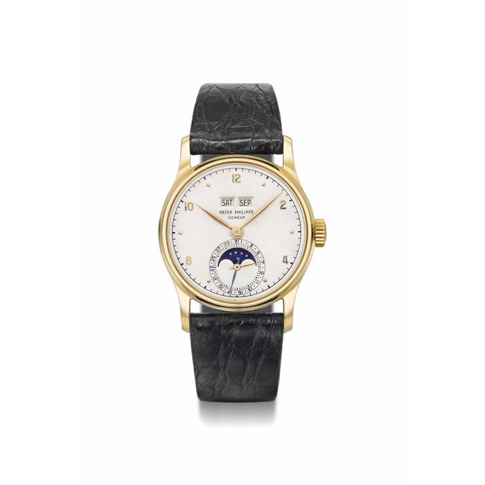 Patek Philippe. A very fine and rare 18K gold perpetual calendar wristwatch with phases of the moon, spare crown, crystal and main spring and other accessories SIGNED PATEK PHILIPPE, GENÈVE, REF. 1526, MOVEMENT NO. 967'635, CASE NO. 668'355, MANUFACTURED IN 1951