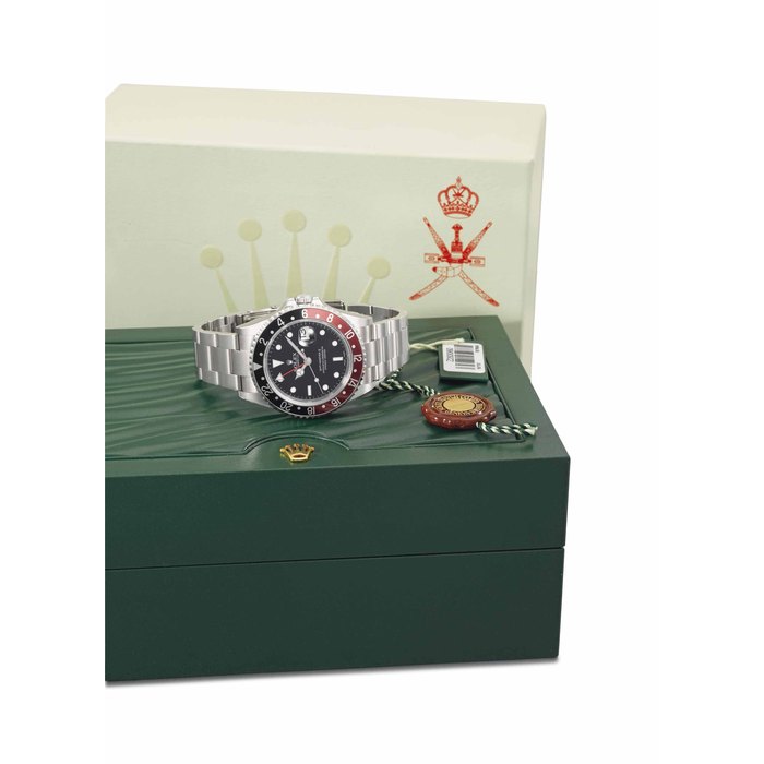 Rolex. A fine and rare stainless steel automatic dual time wristwatch with date, sweep centre seconds, engraved case back, bracelet and box, made for the Sultanate of Oman SIGNED ROLEX, OYSTER PERPETUAL DATE, GMT-MASTER, REF. 16710, CASE NO. Z283060, CIRCA 2006