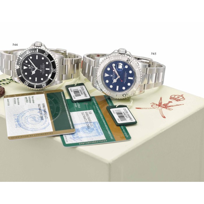 Rolex. A fine and very rare steel and platinum alloy automatic wristwatch with date, sweep centre seconds, hack feature, blue dial, engraved case back, bracelet, Garantie and box, made for the Sultanate of Oman SIGNED ROLEX, OYSTER PERPETUAL DATE, YACHT-MASTER, REF. 116622, CASE NO. A09828P3, CIRCA 2014