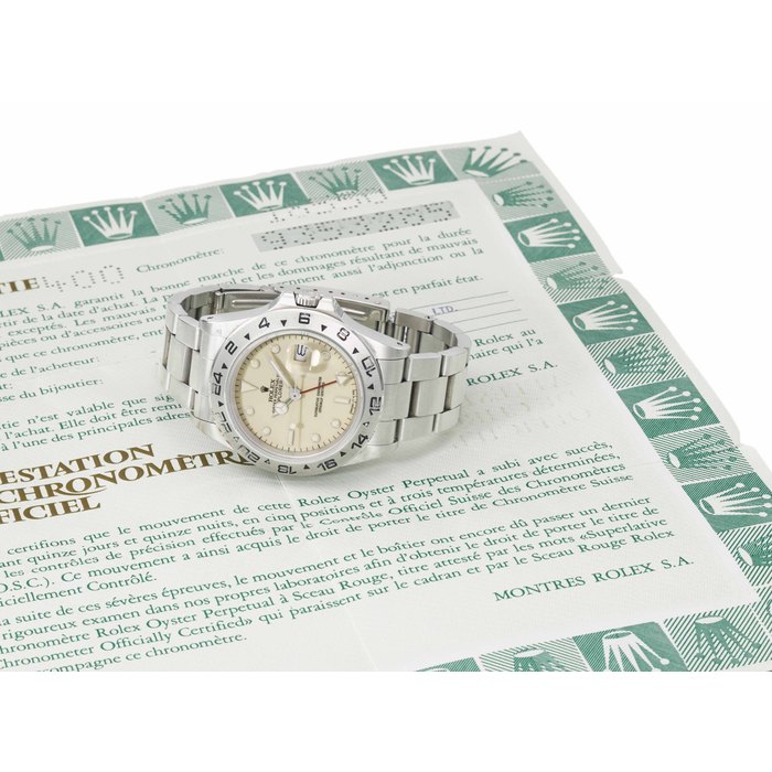 Rolex. A rare stainless steel automatic wristwatch with sweep centre seconds, date, 24 hour hand, bracelet, ivory-coloured "rail" dial and Garantie SIGNED ROLEX, OYSTER PERPETUAL DATE, EXPLORER II, REF. 16550, CASE NO. 9'353'285, CIRCA 1985