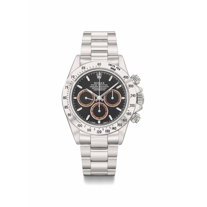 Rolex. A very fine and rare stainless steel automatic chronograph wristwatch with black dial, tropical brown chapter rings, Garantie, box, book and sales tag SIGNED ROLEX, OYSTER PERPETUAL, COSMOGRAPH, DAYTONA, REF. 16520, CASE NO. W326454, CIRCA 1995