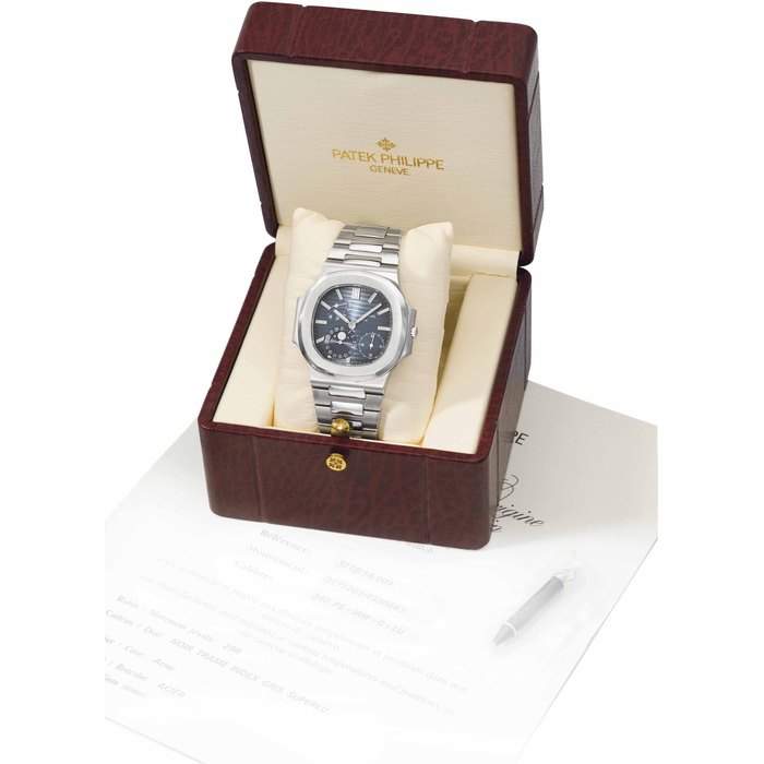 Patek Philippe Patek Philippe. A large stainless steel automatic wristwatch with date, moon phases, power reserve, bracelet, certificate and box SIGNED PATEK PHILIPPE, GENEVE, NAUTILUS MODEL, REF. 3712/1A, MOVEMENT NO. 3'171'201, CASE NO. 4'330'443, MANUFACTURED IN 2006, Price & Market Data