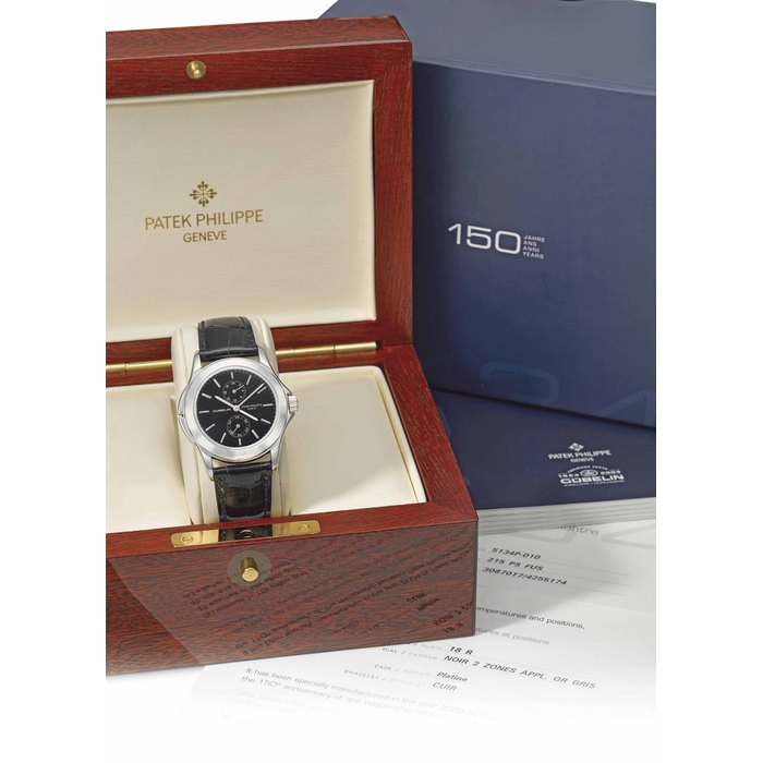 Patek Philippe. A fine and rare platinum limited edition dual time wristwatch with 24 hour indication, black dial, original certificate and box, made for the 150th anniversary of Gübelin Signed Patek Philippe, Genève, Gübelin, Calatrava Travel Time model, ref. 5134, movement no. 3’087’017, case no. 4’255’174, manufactured in 2004