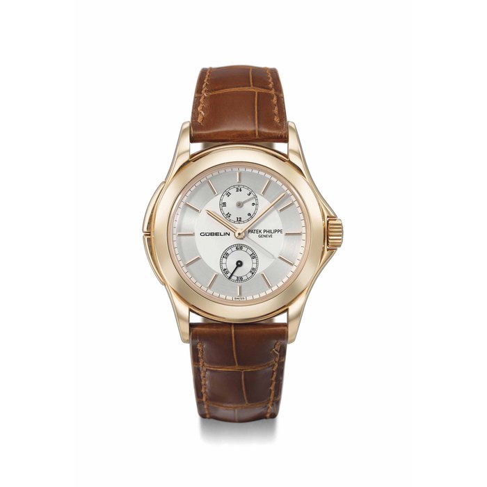 Patek Philippe Patek Philippe. A fine and rare 18K pink gold limited edition dual time wristwatch with 24 hour indication, two-tone silvered dial, original certificate and box, made for the 150th anniversary of Gübelin Signed Patek Philippe, Genève, Gübelin, Calatrava Travel Time model, ref. 5134, movement no. 3'087'180, case no. 4'237'310, manufactured in 2003, Price & Market Data