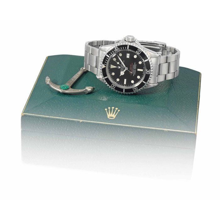 Rolex. A very rare stainless steel automatic wristwatch with sweep centre seconds, date, gas escape valve, “Double Red MKI” dial, “patent pending” case, bracelet, anchor and box Signed Rolex, Oyster Perpetual Date, Sea-Dweller, Submariner 2000, 2000ft=610m, "Double Red" model, ref. 1665, case no. 2'117'426, circa 1967