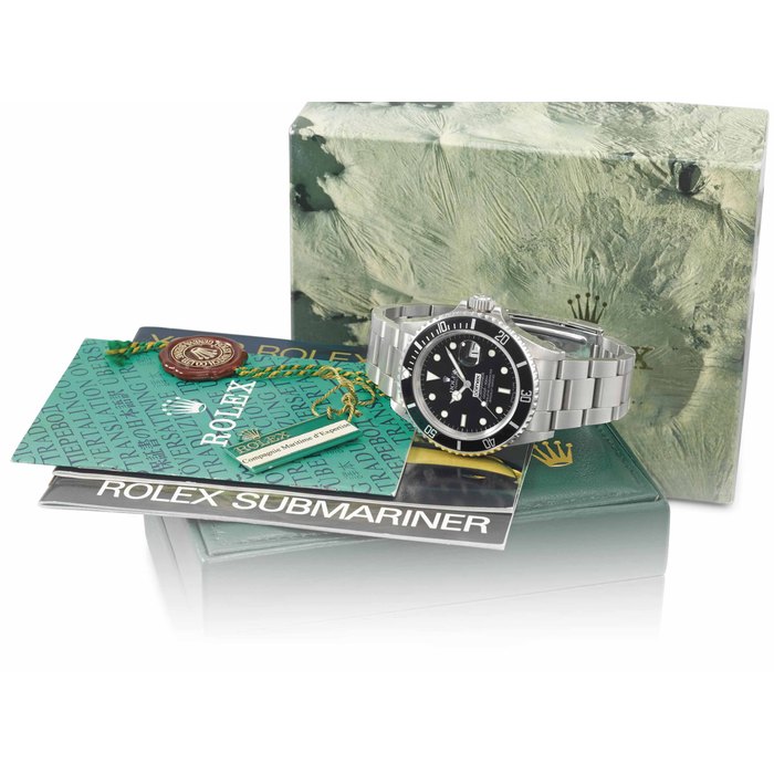 Rolex. A very rare stainless steel automatic wristwatch with sweep centre seconds, hack feature, date, bracelet, and Garantie, made for COMEX Signed Rolex, Oyster Perpetual Date, Submariner, 1000ft=300m, ref. 16800, case no. R381411, COMEX issue no. 6295, circa 1987