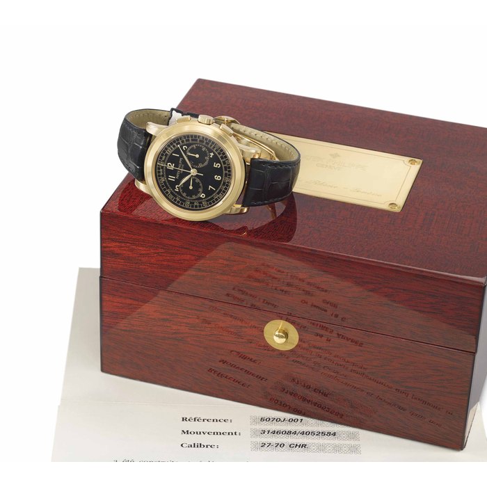 Patek Philippe. A large and rare 18K gold chronograph wristwatch with black dial, original certificate and box Signed Patek Philippe, Genève, ref. 5070, movement no. 3'146'084, case no. 4'052'584, manufactured in 1998