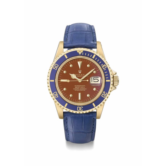 Rolex. An extremely fine, rare and attractive 18K gold automatic wristwatch with sweep centre seconds, date and tropical dial Signed Rolex, Oyster Perpetual Date, Submariner, 660ft = 200m, ref. 1680, case no. 5’726’793, circa 1978