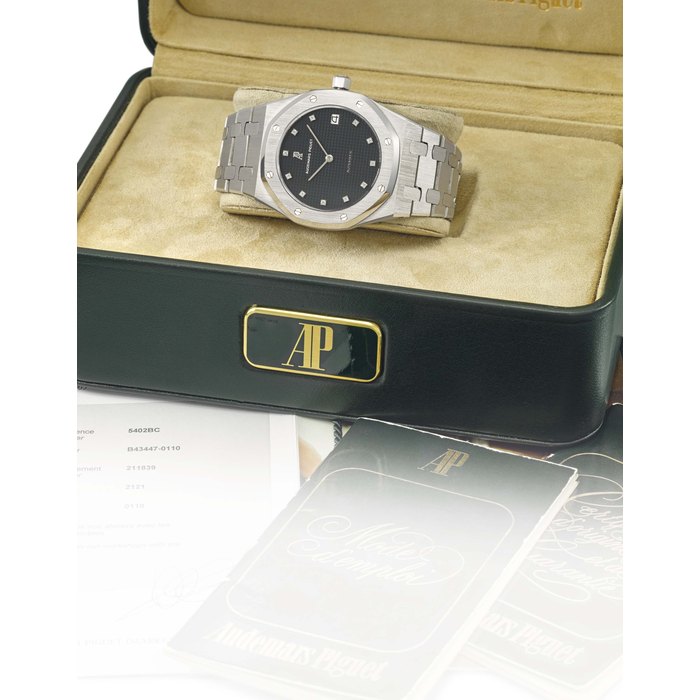 Audemars Piguet. A fine and very rare octagonal tonneau-shaped 18K white gold automatic wristwatch with date, bracelet, diamond-set indexes, certificate and box Signed Audemars Piguet, Automatic, Royal Oak model, Ref. 5402BC, No 110, movement no. 211’839, case no. B43447-0110, circa 1981