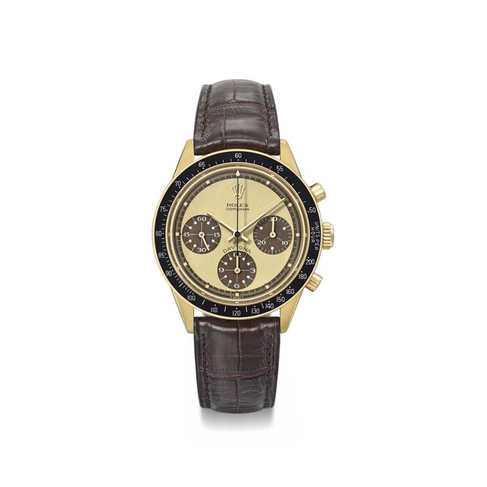 Rolex. An exceptionally rare and possibly unique 18K gold chronograph wristwatch with tropical lemon dial and white numerals inside the subsidiary dials Signed Rolex, Cosmograph, Daytona, Paul Newman model, ref. 6264, case no. 2'357'384, circa 1970