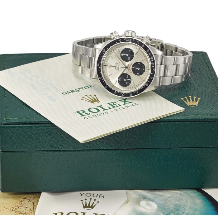 Rolex. A fine and rare stainless steel chronograph wristwatch with bracelet, original guarantee and box Signed Rolex, Oyster Cosmograph, Daytona, “Big Red” model, ref. 6263, case no. 4'128'565, manufactured in 1976