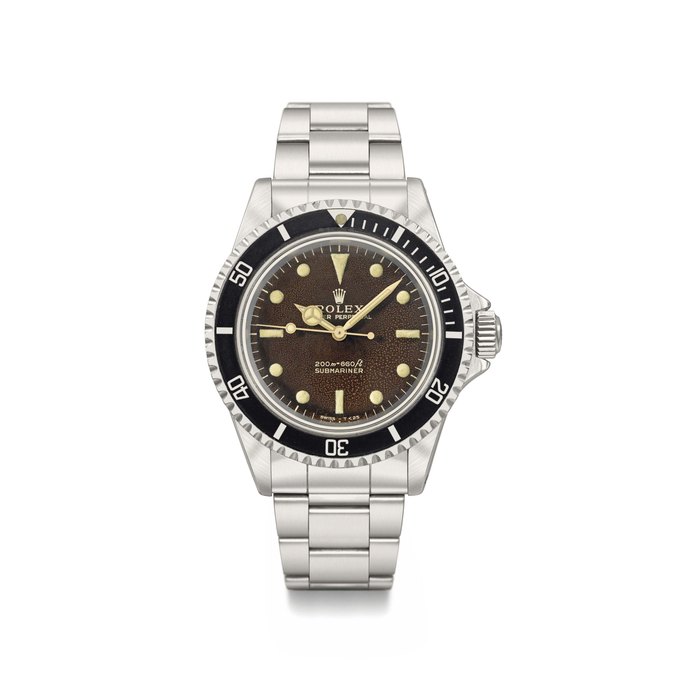 Rolex. A fine and highly attractive stainless steel automatic wristwatch with sweep centre seconds, tropical dial and bracelet Signed Rolex, Oyster Perpetual, 200m = 660ft, Submariner, ref. 5513, case no. 1’218’041, circa 1965