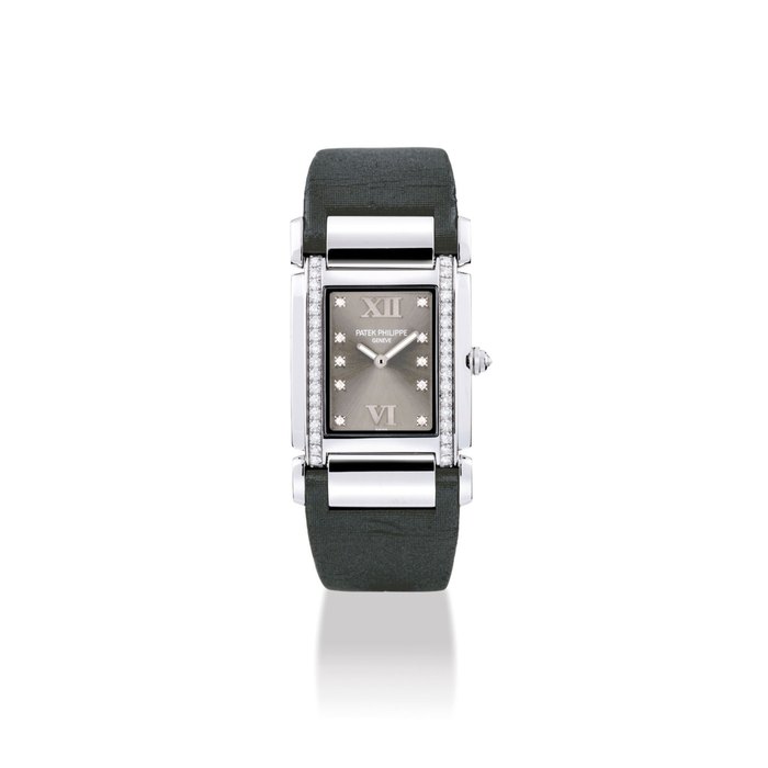 PATEK PHILIPPE. A LADY ’ S 18K WHITE GOLD AND DIAMOND-SET RECTANGULAR WRISTWATCH SIGNED PATEK PHILIPPE, GENEVE, TWENTY~4 MODEL, REF. 4920, MOVEMENT NO. 3’381’372, CASE NO. 4’287’746, MANUFACTURED IN 2005