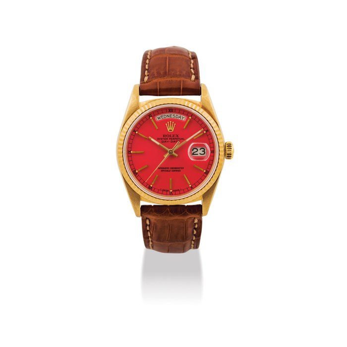 ROLEX. A FINE AND RARE 18K GOLD AUTOMATIC WRISTWATCH WITH SWEEP CENTRE SECONDS, DAY, DATE AND RED LACQUERED DIAL SIGNED ROLEX, OYSTER PERPETUAL, DAY-DATE MODEL, REF. 18038, CASE NO. 9’312’526, CIRCA 1985