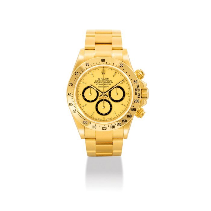 Rolex ROLEX. A RARE AND ATTRACTIVE 18K GOLD AUTOMATIC CHRONOGRAPH WRISTWATCH WITH BRACELET AND "FLOATING COSMOGRAPH' DIAL SIGNED ROLEX, OYSTER PERPETUAL, COSMOGRAPH, DAYTONA, REF. 16528, CASE NO. L236114, CIRCA 1989 · 16528