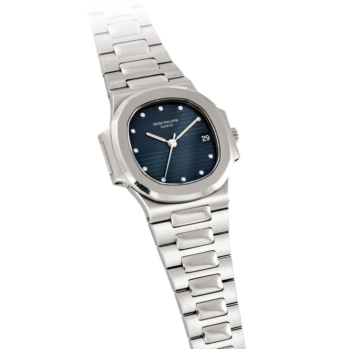 PATEK PHILIPPE. A RARE AND ATTRACTIVE STAINLESS STEEL AND DIAMOND-SET AUTOMATIC WRISTWATCH WITH SWEEP CENTRE SECONDS, DATE, BRACELET, ORIGINAL CERTIFICATE AND BOX SIGNED PATEK PHILIPPE, GENEVE, NAUTILUS MODEL, REF. 3800/1, MOVEMENT NO. 1'423'918, CASE NO. 2'803'602, MANUFACTURED IN 1984