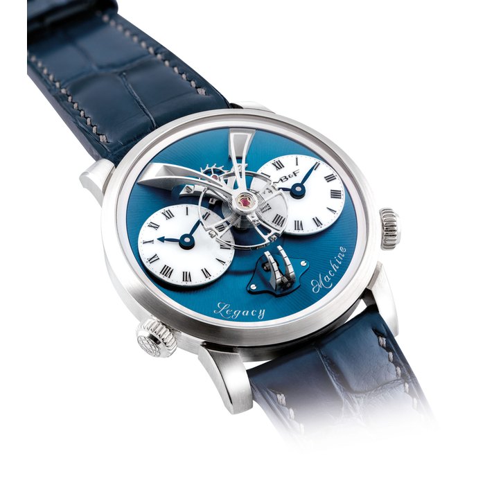 MB&F. A FINE AND VERY RARE PLATINUM LIMITED EDITION DUAL TIME WRISTWATCH WITH THREE-DIMENSIONAL MOVEMENT AND VERTICAL POWER RESERVE SIGNED MB&F, JEAN-FRANCOIS MOJON AND KARI VOUTILAINEN, LEGACY MACHINE N°1 MODEL, NO. 3/33, CASE NO. 50P36826, CIRCA 2014