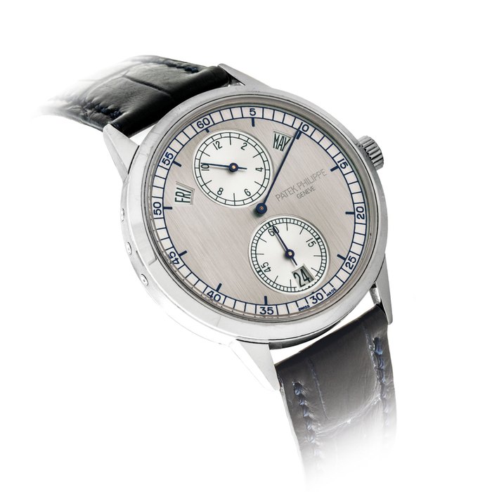 Patek Philippe PATEK PHILIPPE. A FINE 18K WHITE GOLD AUTOMATIC ANNUAL CALENDAR WRISTWATCH WITH REGULATOR-STYLE DIAL, ORIGINAL CERTIFICATE AND BOX SIGNED PATEK PHILIPPE, GENEVE, REF. 5235G, MOVEMENT NO. 5’727’936, CASE NO. 4’690’714, CIRCA 2014, Price & Market Data