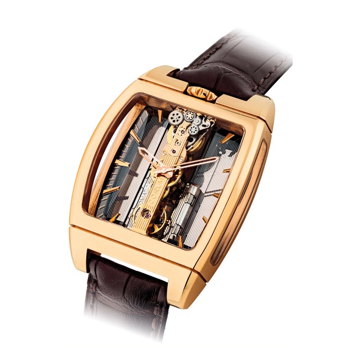 CORUM. A FINE 18K PINK GOLD TONNEAU-SHAPED AUTOMATIC SKELETONISED WRISTWATCH WITH LINEAR MOVEMENT SIGNED CORUM, GOLDEN BRIDGE MODEL, REF. 313.165.55/0002 GL10R, CASE NO. 2'309'724, CIRCA 2013