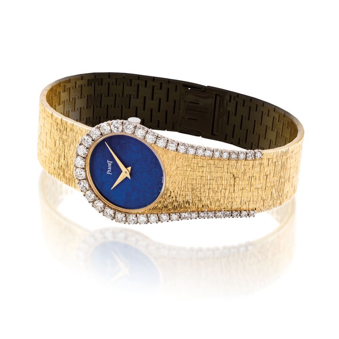 PIAGET. A LADY ’ S RARE AND UNUSUAL 18K GOLD AND DIAMOND-SET BRACELET WATCH WITH LAPIS LAZULI DIAL SIGNED PIAGET, REF. 9181 A6, CASE NO. 200’017, CIRCA 1970