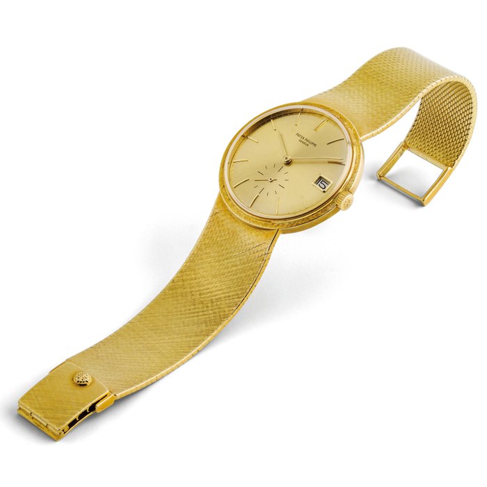 PATEK PHILIPPE. AN 18K GOLD AUTOMATIC BRACELET WATCH WITH DATE SIGNED PATEK PHILIPPE, GENEVE, REF. 3445/6, MOVEMENT NO. 1’231’598, CASE NO. 329’286, MANUFACTURED IN 1971