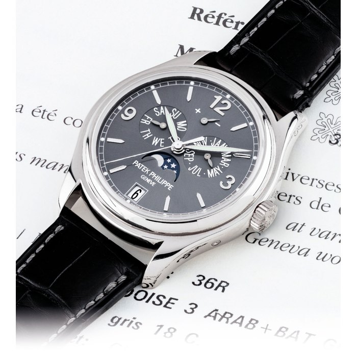PATEK PHILIPPE. A FINE 18K WHITE GOLD AUTOMATIC ANNUAL CALENDAR WRISTWATCH WITH SWEEP CENTRE SECONDS, POWER RESERVE AND MOON PHASES SIGNED PATEK PHILIPPE, GENEVE, REF. 5146, MOVEMENT NO. 3'805'016, CASE NO. 4'722'979, CIRCA 2010