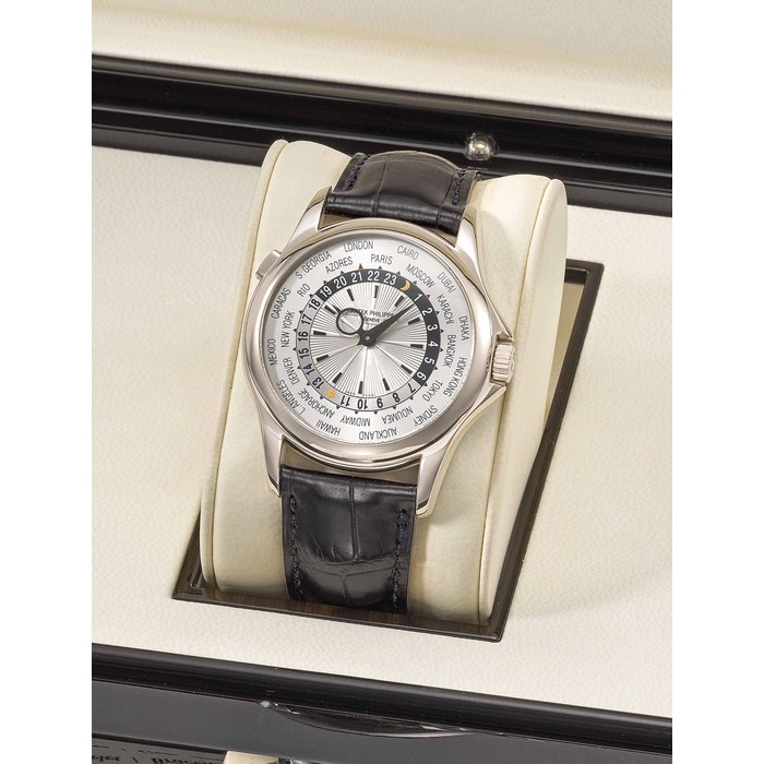 Patek Philippe. A fine and rare 18K white gold automatic world time wristwatch with original certificate and box Signed Patek Philippe, Genève, ref. 5130, movement no. 3'672'274, case no. 4'464'314, manufactured in 2008