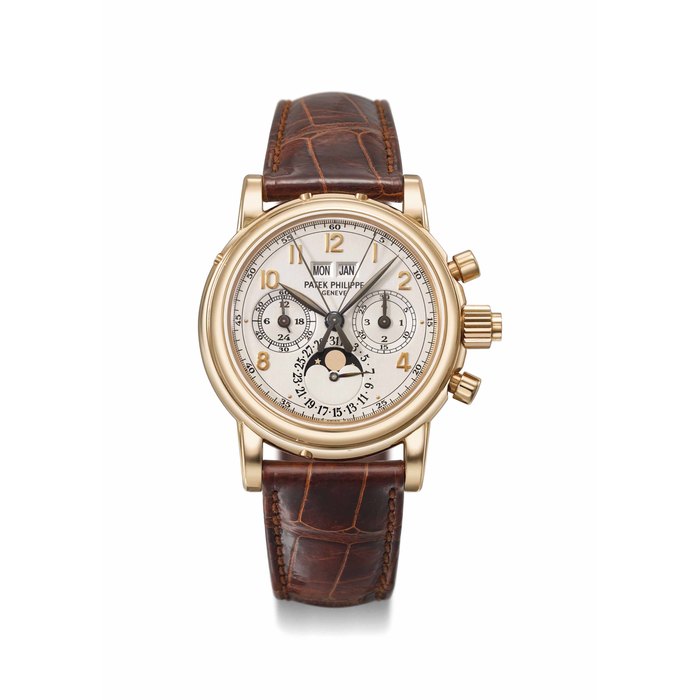 PATEK PHILIPPE. A VERY FINE AND RARE 18K PINK GOLD PERPETUAL CALENDAR SPLIT SECONDS CHRONOGRAPH WRISTWATCH WITH MOON PHASES, 24 HOUR AND LEAP YEAR INDICATION, SPECIALLY COMMISSIONED BLACK HANDS, ADDITIONAL CASE BACK, ORIGINAL CERTIFICATE AND BOX SIGNED PATEK PHILIPPE, GENEVE, REF. 5004R-017, MOVEMENT NO. 879’718, CASE NO. 4’037’690, MANUFACTURED IN 1999