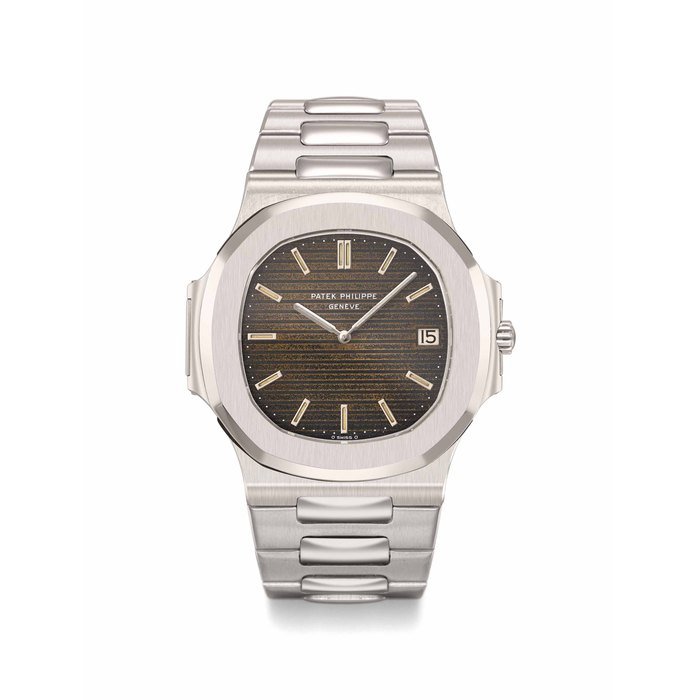 Patek Philippe. An extremely rare and very attractive stainless steel automatic wristwatch with tropical dial, date, bracelet and Nautilus cork box Signed Patek Philippe, Genève, Nautilus model, ref. 3700/1, movement no. 1’300’674, case no. 532’648, movement manufactured in 1973, finalized and sold in 1977