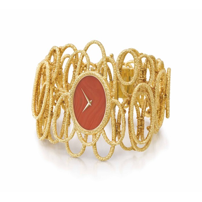 Piaget. A fine and very elegant 18K gold and coral bracelet watch with integral 18K gold asymmetric link bracelet Signed Piaget, Esclave model, ref. 9850 D 72, movement no. 7’401’867 case no. 179’789, manufactured in 1973