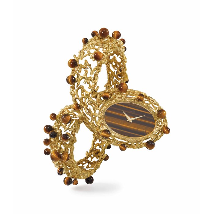 Piaget. A very rare and extremely elegant lady’s textured and sculptural 18K gold and tiger’s eye bracelet watch with concealed clasp Signed Piaget, ref. 9850 D 730, movement no. 718'209, case no. 1'893'06, manufactured in 1972