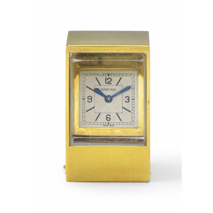 Cartier. A Fine and Rare 18k Gold and Lead Glass Miniature Rectangular-shaped "Mystery" Desk Clock Signed Cartier, European Watch & Clock Co. Inc., France, Case No. 80640, 972, Movement No. 87592, Manufactured in 1938