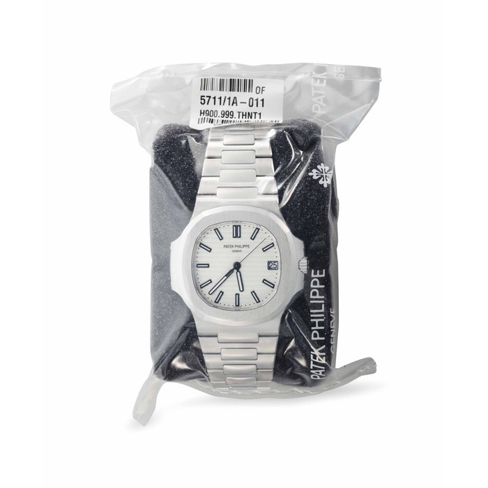 Patek Philippe. A Factory Sealed Stainless Steel Automatic Wristwatch with Date, Center Seconds and Bracelet Signed Patek Philippe, Genève, Ref. 5711/1A, Nautilus Model, Movement No. 5'960'087, Case No. 6'101'828, Circa 2016