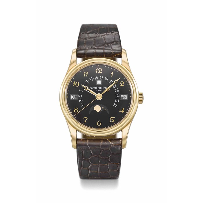 Patek Philippe. A very fine and rare 18K gold automatic perpetual calendar wristwatch with black dial, Breguet numerals, retrograde date, leap year indication, moon phases, solid case back, setting pin, original certificate and box Signed Patek Philippe, Genève, Ref. 5050J-024, Movement No. 3’720’224, Case No. 2’980’944, Circa 2009